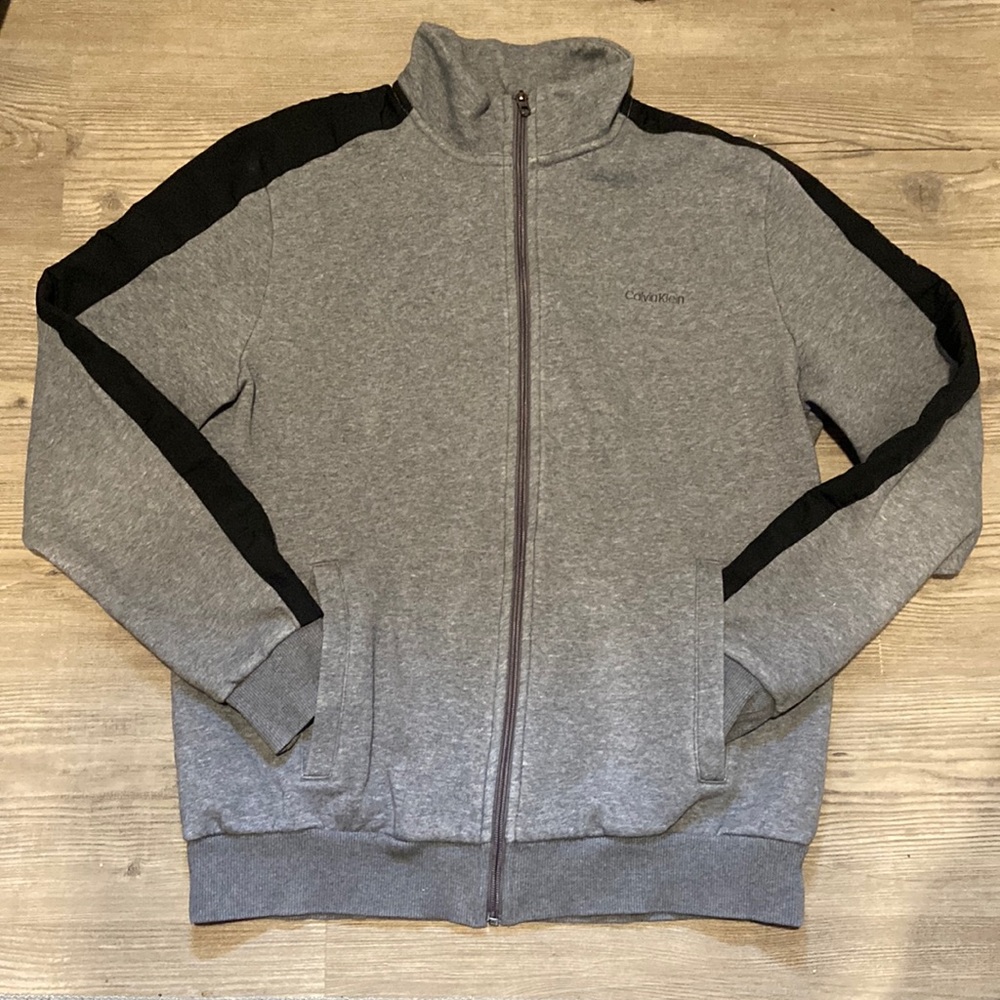 Calvin Klein zip up gray sweatshirt with black stripe on sleeves, Size Large